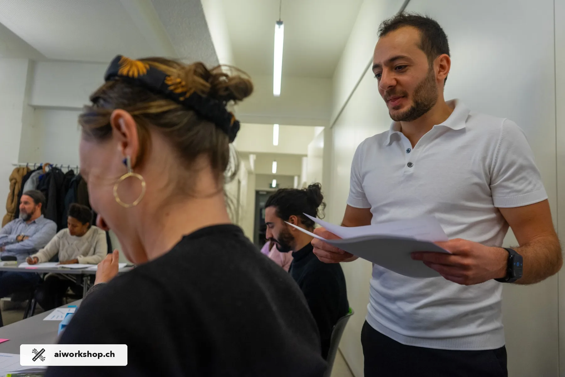 The facilitator supporting a participant during an individual AI Workshop exercise in Lausanne